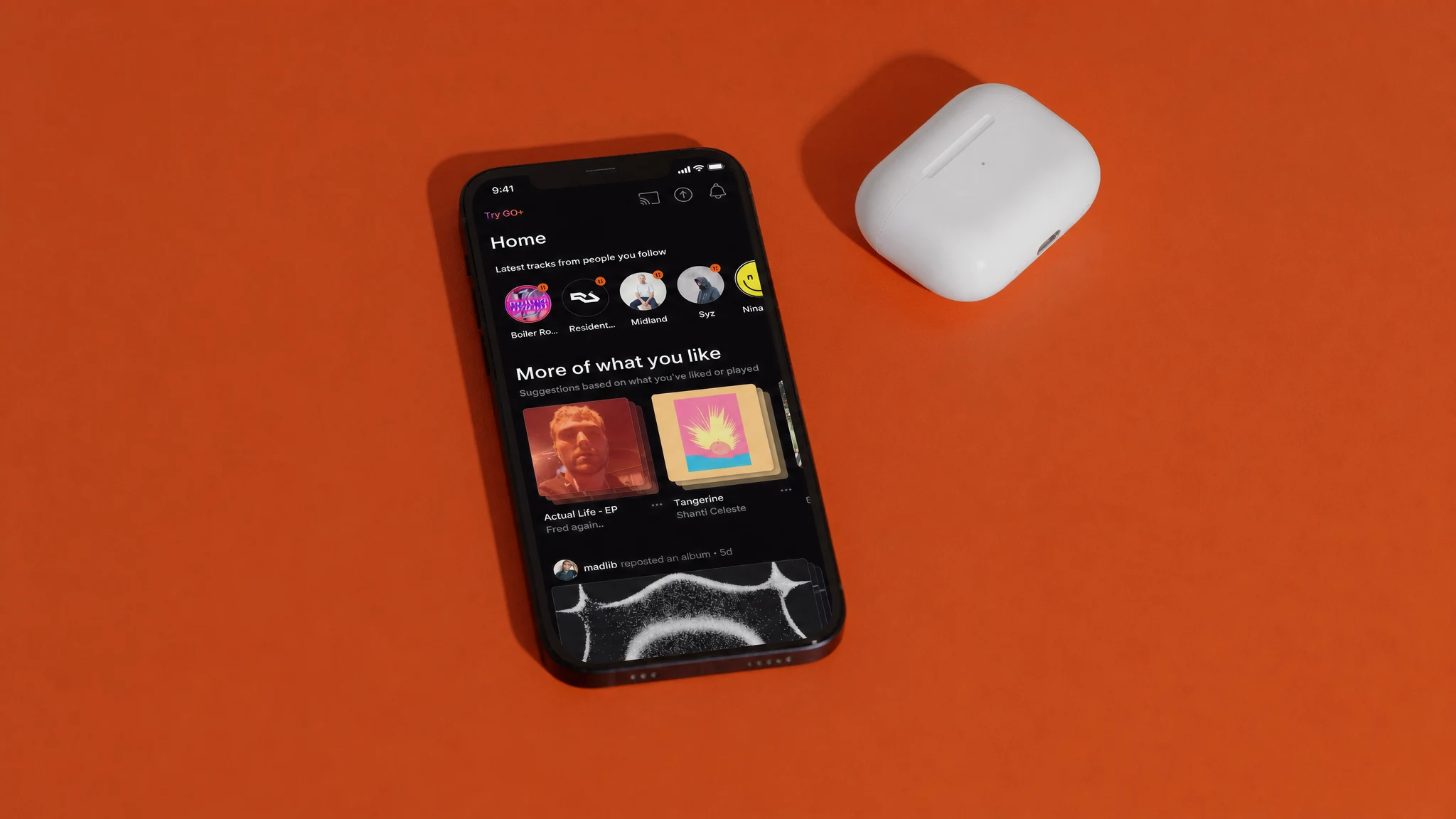 SoundCloud mobile app on an orange background